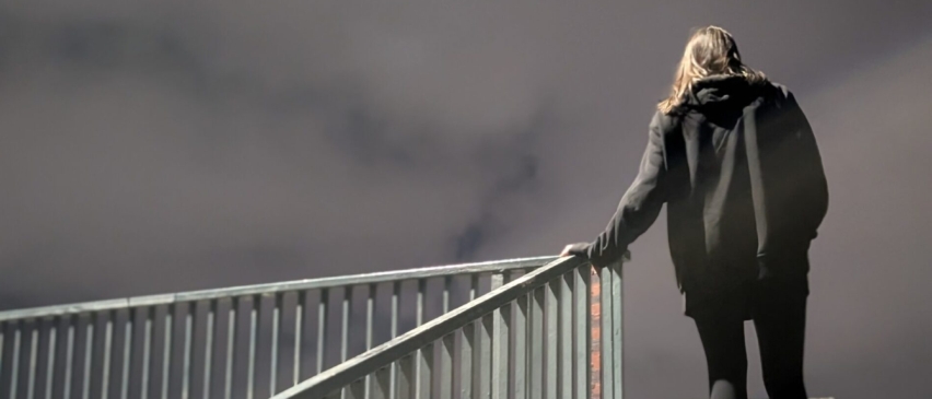 woman-stairs-scaled-e1759323732528_852x365_acf_cropped
